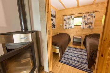 Фото номера Коттедж с 2 спальнями и сауной Дома для отпуска Resort Naaranlahti Cottages г. Нааранлахти 19
