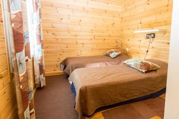 Фото номера Дом с 3 спальнями Дома для отпуска Resort Naaranlahti Cottages г. Нааранлахти 10