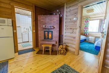 Фото номера Большой коттедж с 2 спальнями и сауной Дома для отпуска Resort Naaranlahti Cottages г. Нааранлахти 5